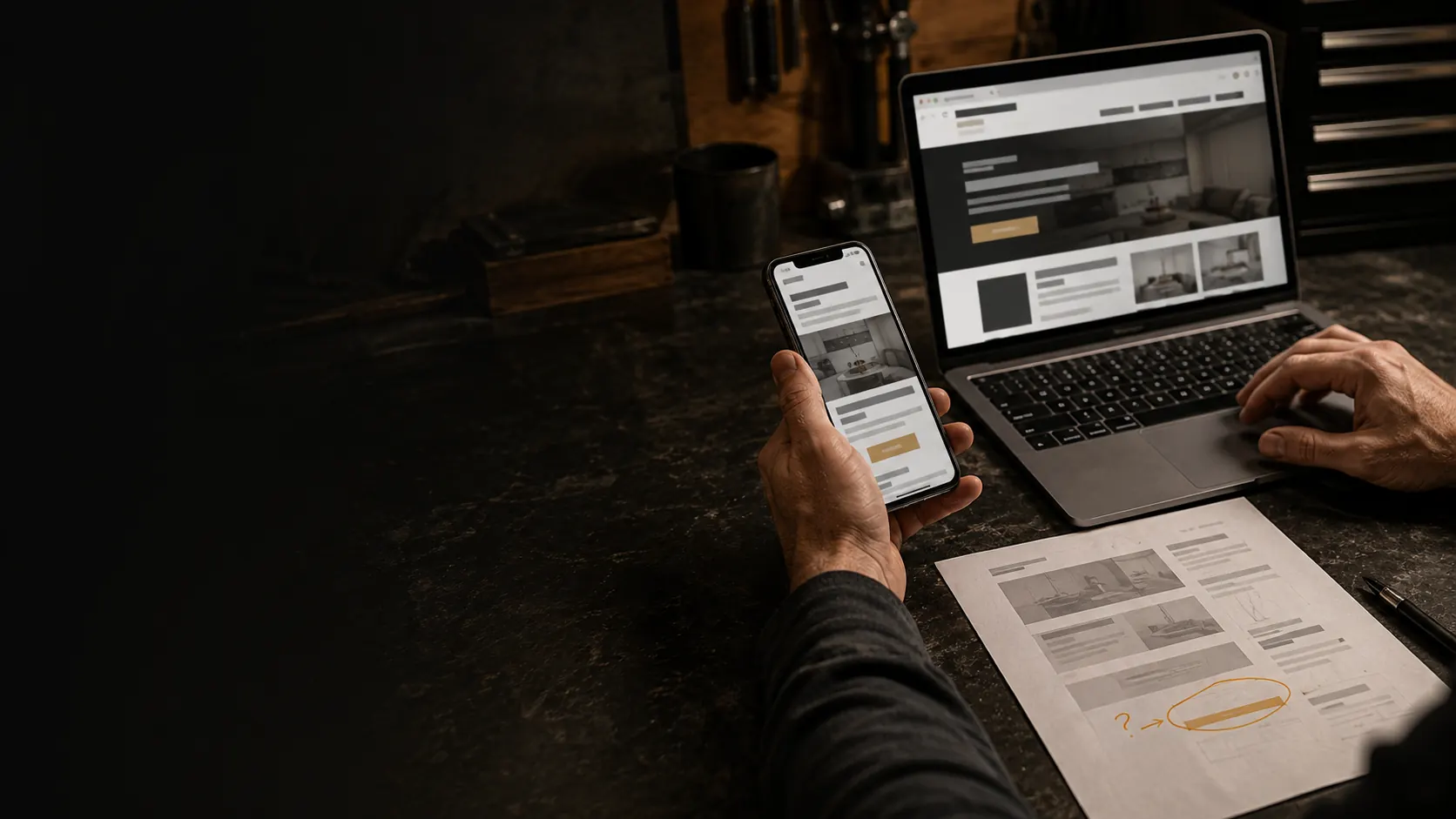 Owner-operator comparing a service-business website on a phone and laptop
